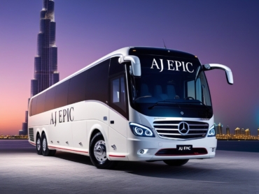 Elegant white luxury Mercedes bus parked outside a famous Dubai landmark at dusk.
