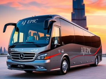 Elegant luxury bus with stylish red lines parked outside a famous Dubai landmark.